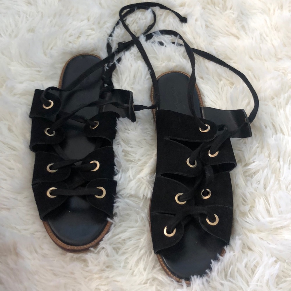Urban Outfitters lace up black sandals with gold
